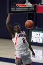 Arizona guard Bennedict Mathurin (0) dunks against Arizona State during the first half of an NCAA college basketball game, Monday, Jan. 25, 2021, in Tucson, Ariz. (AP Photo/Rick Scuteri)