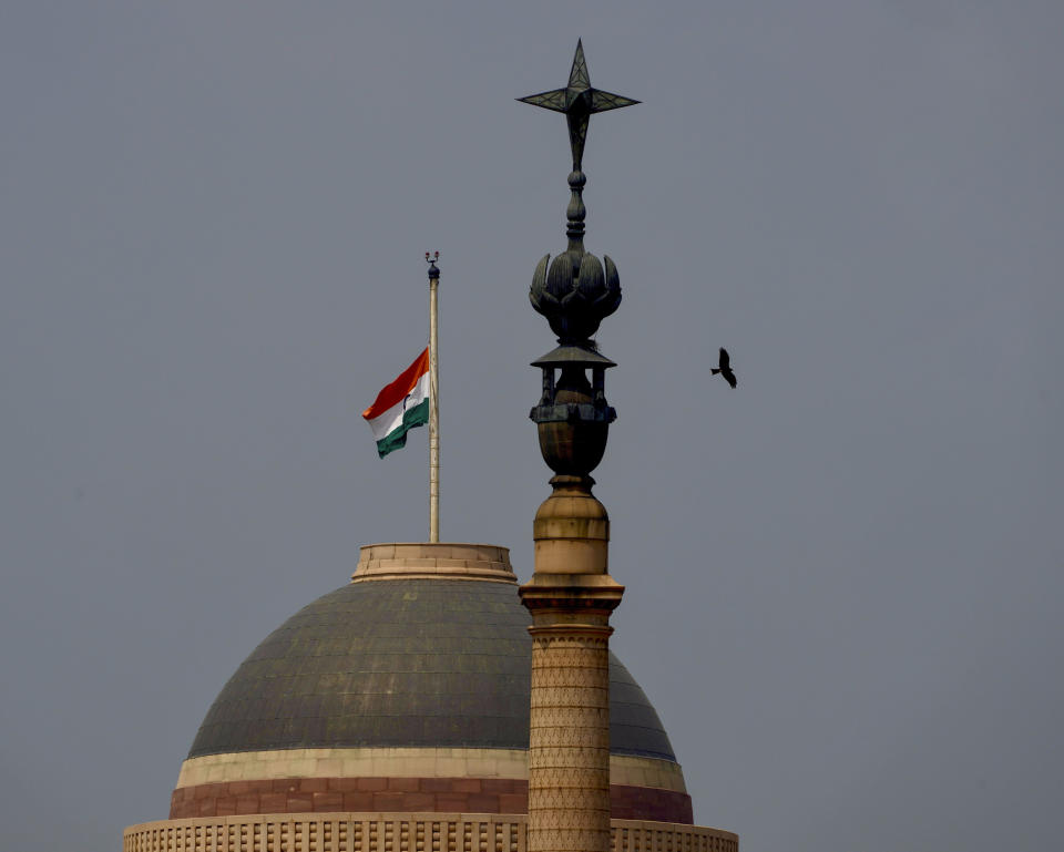 The Indian flag flies at half-mast at the Indian Presidential Palace following Thursday’s death of Britain's Queen Elizabeth II in New Delhi, India, Sunday, Sept.11, 2022. (AP Photo/Manish Swarup)