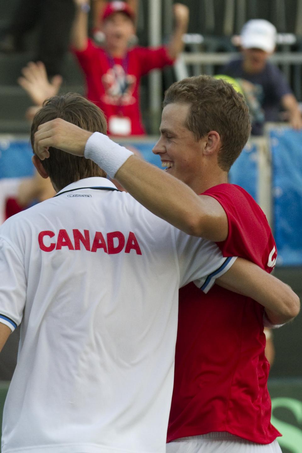 Canadian tennis players Vasek Pospisil and Daniel Nestor (L) react after win the game against Israeli tennis team players Jonathan Erlich and Andy Ram during their Davis Cup world group doubles playoff tennis match in Ramat Hasharon near Tel Aviv on September 17, 2011. Canadian team won 6-4 3-6 4-6 4-6  againts Israel.  AFP PHOTO/JACK GUEZ (Photo credit should read JACK GUEZ/AFP/Getty Images)