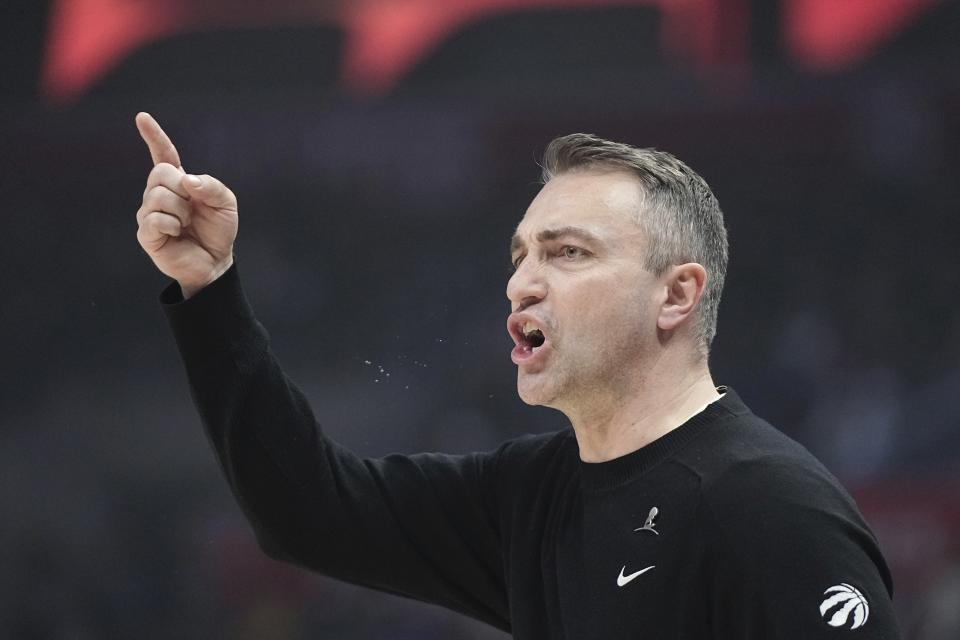 Toronto Raptors head coach Darko Rajakovic gestures toward officials during the first half of an NBA basketball game against the Los Angeles Clippers Wednesday, Jan. 10, 2024, in Los Angeles. (AP Photo/Mark J. Terrill)