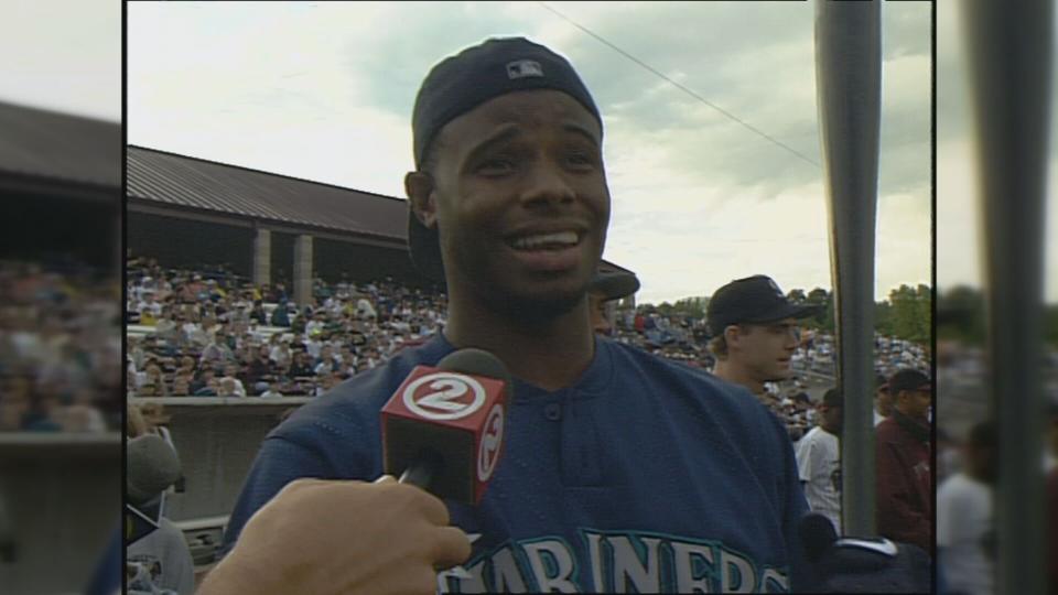 Ken Griffey Jr. talks to the media as David Ortiz hits.