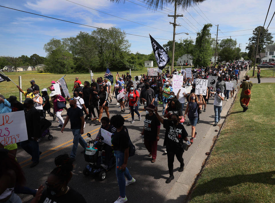 Protesters calling for justice for Andrew Brown Jr. march on May 02, 2021, in Elizabeth City, North Carolina.  / Credit: Joe Raedle/Getty Images