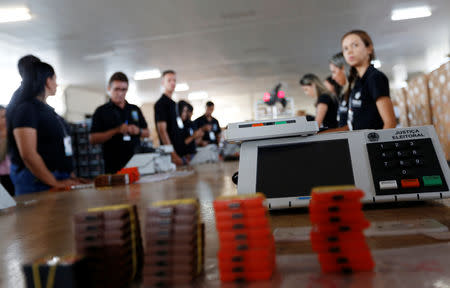 Brazilian electoral workers seal electronic ballot boxes in Brasilia, Brazil September 19, 2018. REUTERS/Adriano Machado