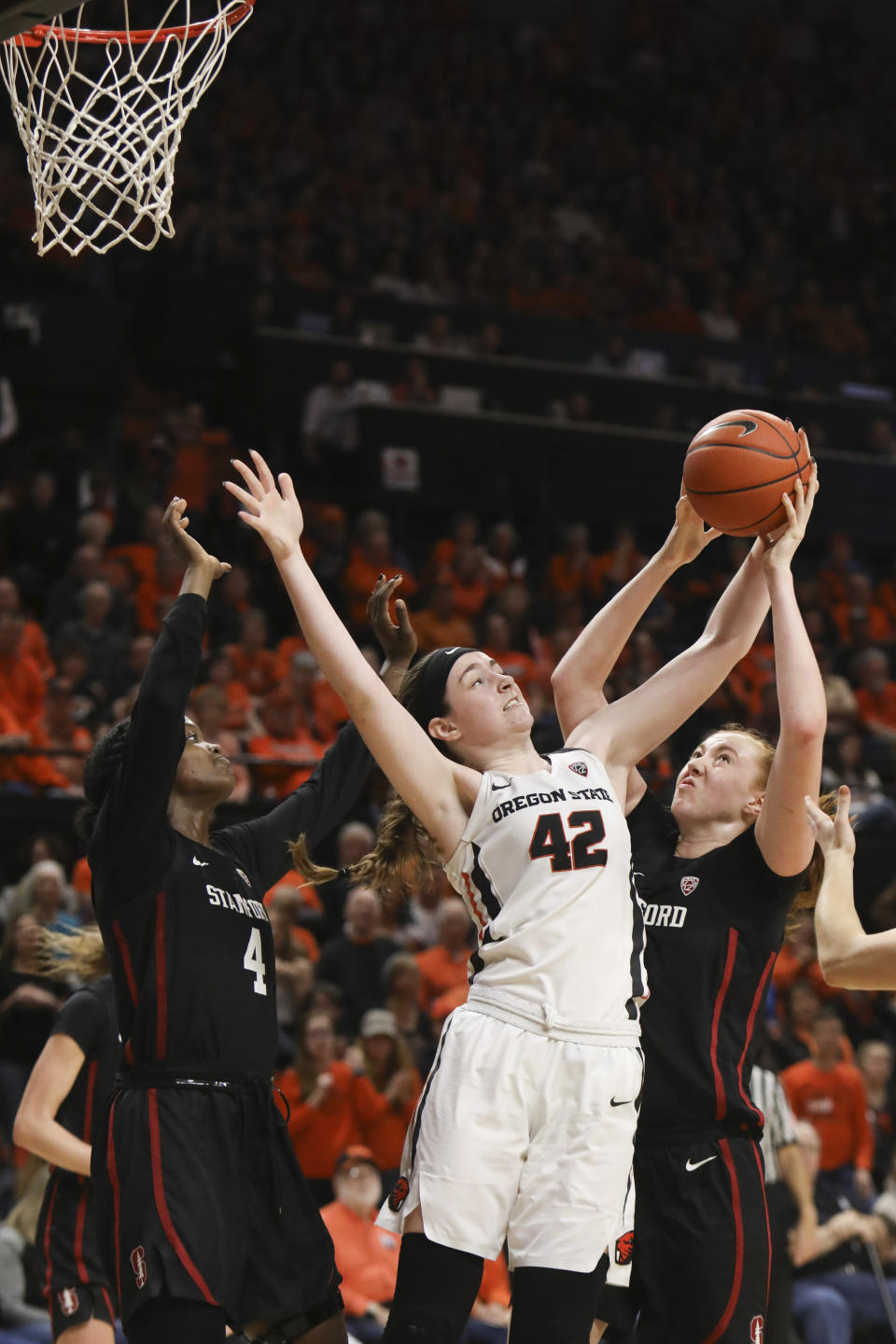 Stanford's Nadia Fingall (4) and Ashten Prechtel (11) fight for possession of a rebound with Oregon State's Kennedy Brown (42) during the second half of an NCAA college basketball game in Corvallis, Ore., Sunday, Jan. 19, 2020. (AP Photo/Amanda Loman)