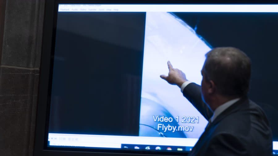 <em>Deputy Director of Naval Intelligence Scott Bray points to a video display of a UAP during a hearing on Capitol Hill, Tuesday, May 17, 2022, in Washington.</em> (AP Photo/Alex Brandon)