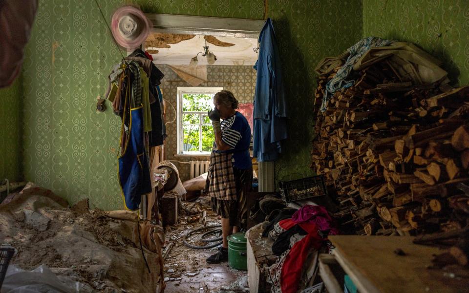 Kateryna Kostiantynivna stands her shattered home while recalling first week of the Russian invasion - John Moore/Getty Images