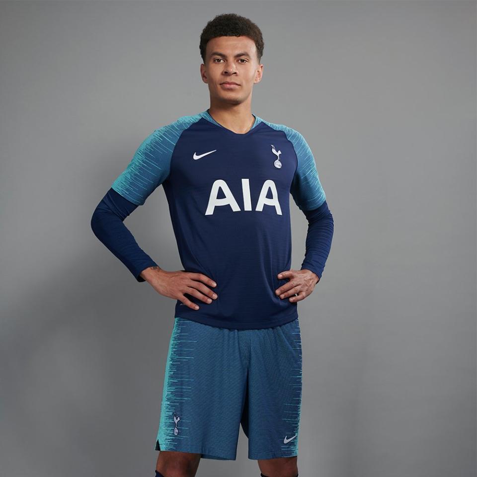 Dele Alli models the new away kit