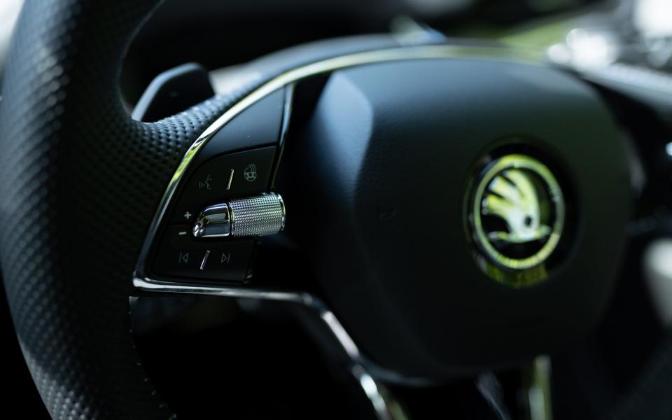 Cruise control is monitored by a lever below the indicator arm; the steering wheel also has paddles which control the strength of battery regeneration