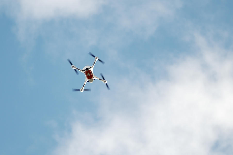 A drone with a case for medical stuff flies during a presentation for media, near the Labor Berlin laboratory in Berlin, Germany, Monday, Nov. 23, 2020. Each drone can carry about 40 test samples, not only for Corona tests, that need to be examined in a laboratory. (AP Photo/Markus Schreiber)