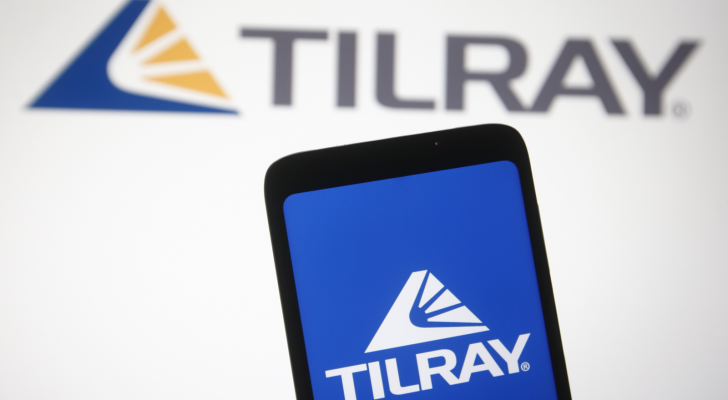 In this photo illustration Tilray (TLRY) logo of a Canadian pharmaceutical and cannabis company is seen on a mobile phone and a computer screen.