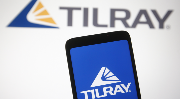 In this photo illustration Tilray logo of a Canadian pharmaceutical and cannabis company is seen on a mobile phone and a computer screen.