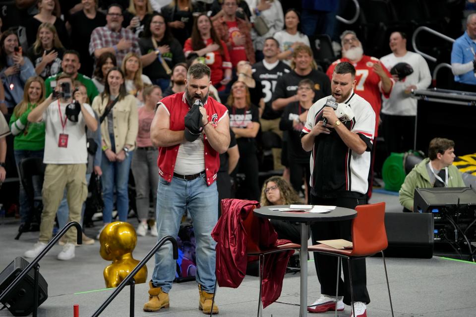 Jason Kelce left, and his brother Travis Kelce led the crowd by singing the National Anthem during their return to their alma mater, the University of Cincinnati, for a live version of their "New Heights" podcast in front of more than 12,500 fans at Fifth Third Arena Thursday, April 8, 2024.