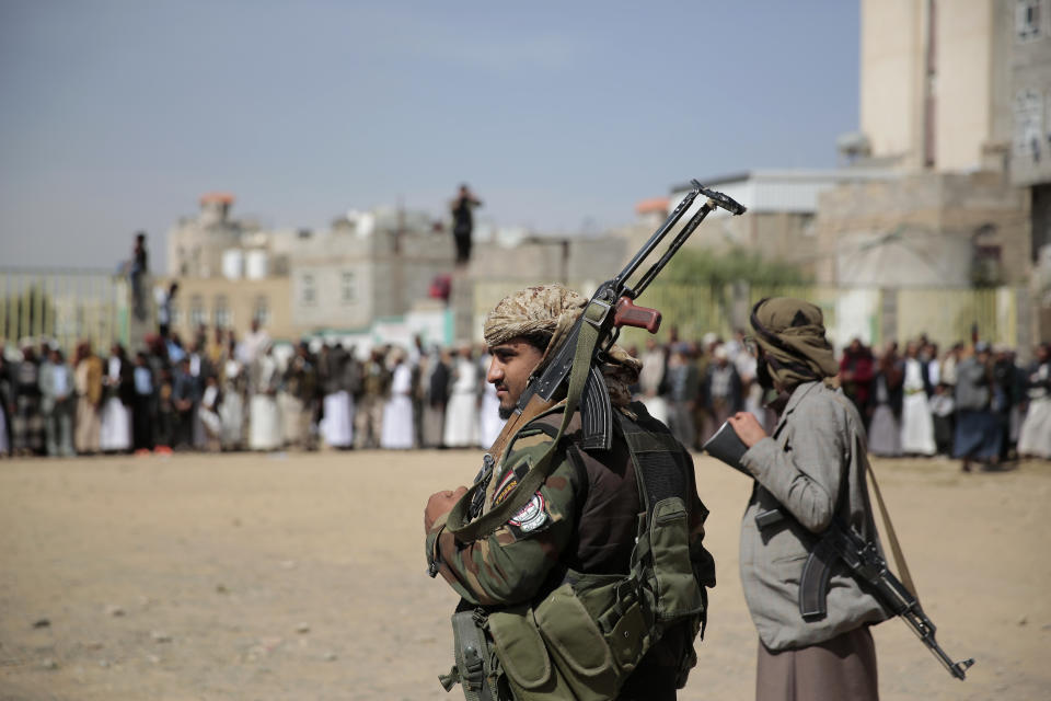 FILE - Armed Houthi fighters attend the funeral procession of Houthi rebel fighters who were killed in recent fighting with forces of Yemen's internationally recognized government, in Sanaa, Yemen, Nov. 24, 2021. While American influence has waned, Russia has made powerful friends, from Shiite militias in Iraq, to Lebanon’s Hezbollah group, to Houthi rebels in Yemen. Largely because of his Syria military intervention, they see Putin as a steady, reliable partner who unlike the Americans does not drop his allies. (AP Photo/Hani Mohammed, File)