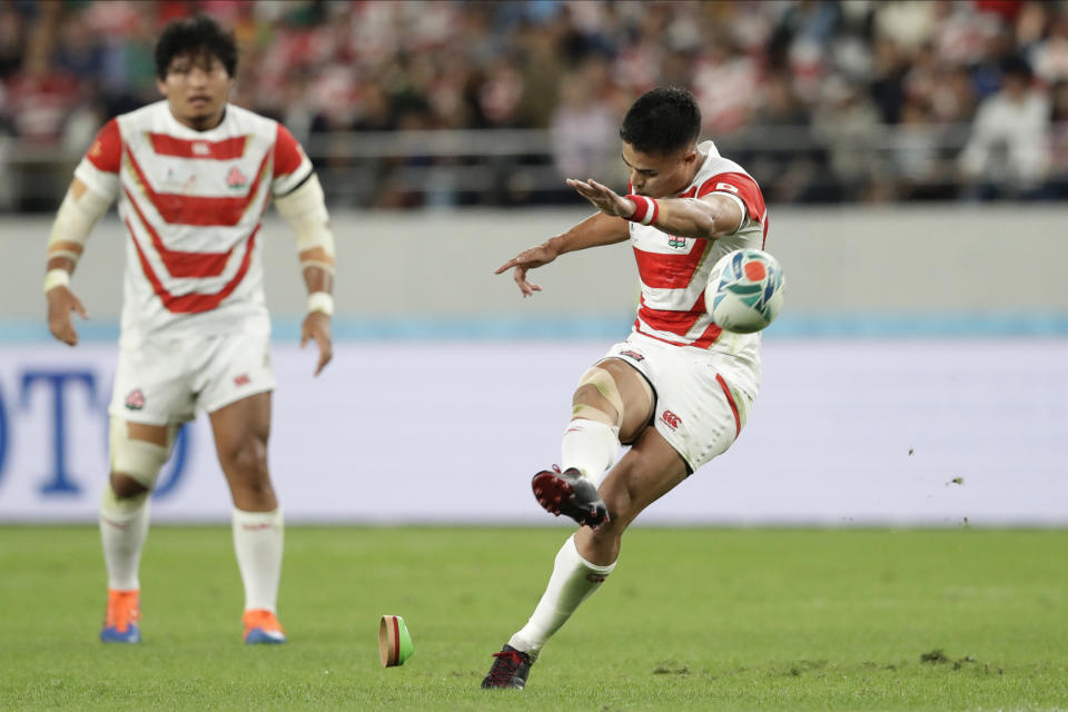 Japan's Yu Tamura kicks a penalty goal during the Rugby World Cup quarterfinal match at Tokyo Stadium between Japan and South Africa in Tokyo, Japan, Sunday, Oct. 20, 2019. (AP Photo/Mark Baker)