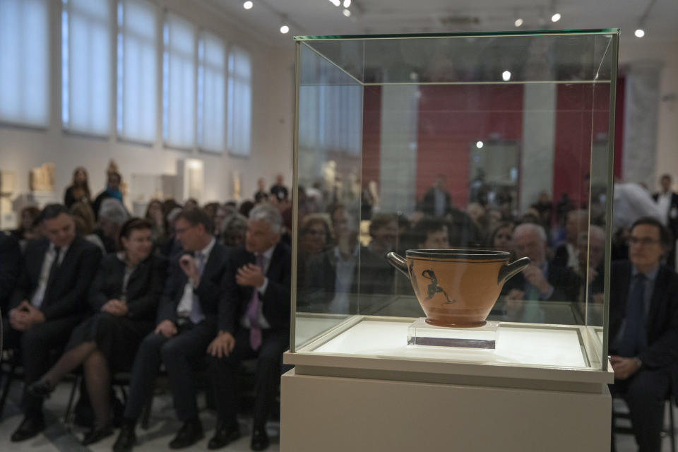 An ancient Greek drinking cup decorated with runners, which was one of the awards presented to Spyros Louis, the Greek winner of the Marathon in the 1896 first modern Olympic Games in Athens, is seen at the National Archaeological Museum in Athens on Wednesday, Nov. 13, 2019. Greece's Culture Ministry said Wednesday the ancient vase has been returned to Athens by the University of Muenster in Germany where it had ended up.(AP Photo/Petros Giannakouris)