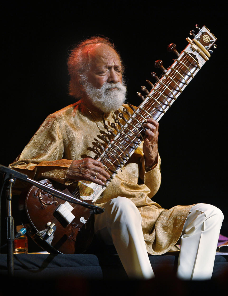 FILE - In this Feb. 7, 2012 file photo, Indian musician Ravi Shankar performs during a concert in Bangalore, India. Shankar, the sitar virtuoso who became a hippie musical icon of the 1960s after hobnobbing with the Beatles and who introduced traditional Indian ragas to Western audiences over an eight-decade career, has died. He was 92. (AP Photo/Aijaz Rahi, File)