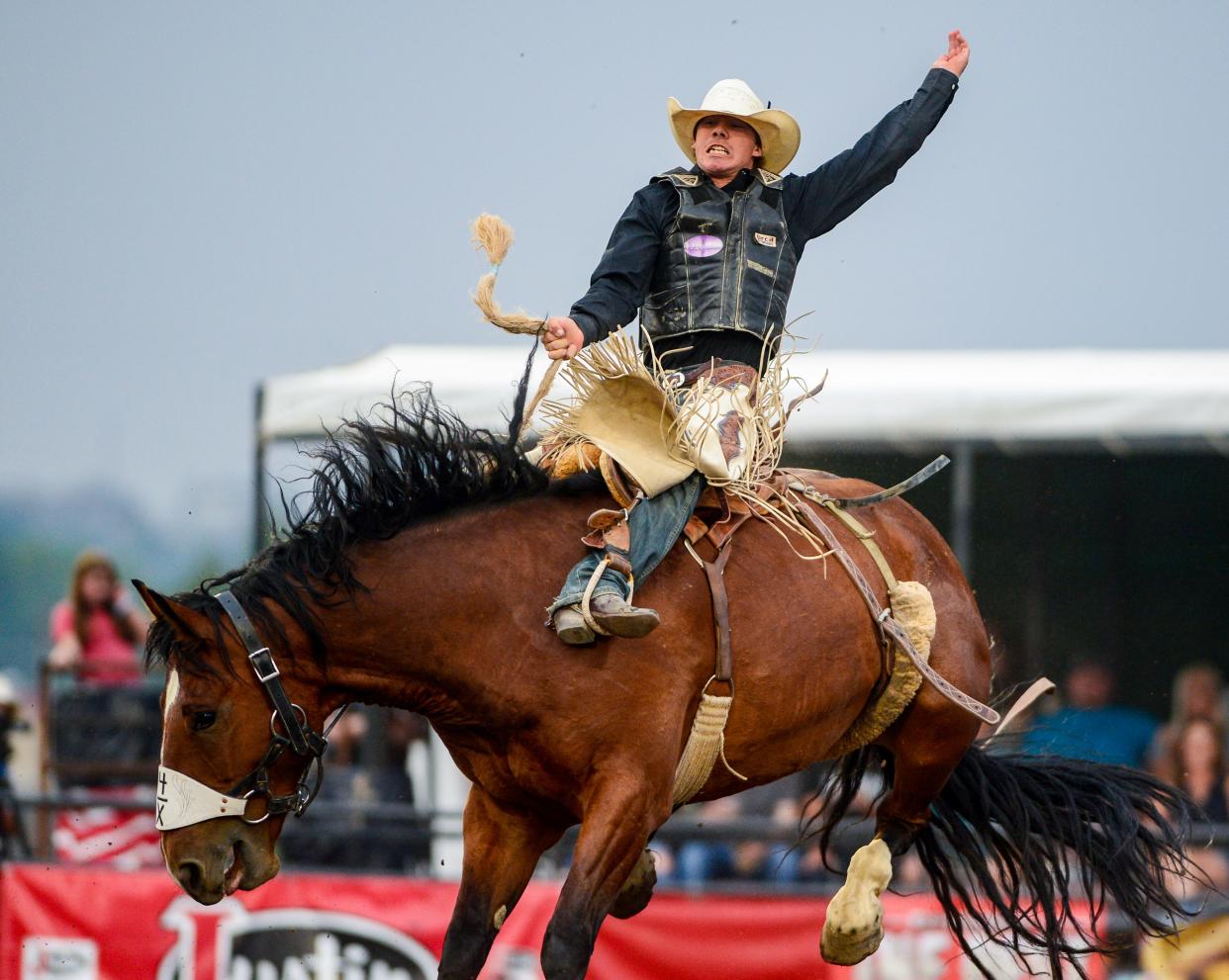 Sage Newman rides in the saddle bronc event during the Big Sky Pro Rodeo in 2021. Newman is atop the world saddle bronc standings heading into next week's National Finals Rodeo in Las Vegas.