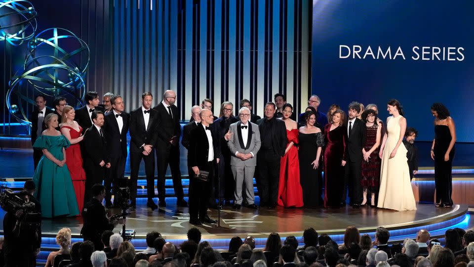 Jesse Armstrong, center, and the team from "Succession" accept the award for outstanding drama series. - Chris Pizzello/Invision/AP