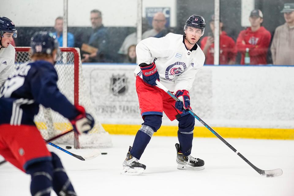 Jul 2, 2023; Columbus, Ohio, USA;  Forward Adam Fantilli (11) moves the puck during the Columbus Blue Jackets development camp at the OhioHealth Chiller North in Lewis Center. 