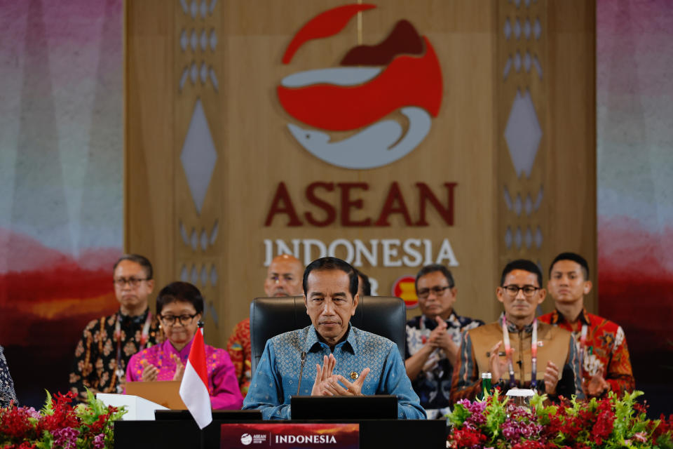 Indonesian President Joko Widodo, center, applauds during the 15th Indonesia-Malaysia-Thailand Growth Triangle (IMT-GT) Summit on the sidelines of the 42nd ASEAN Summit in Labuan Bajo, East Nusa Tenggara province, Indonesia, Thursday, May 11, 2023. (Willy Kurniawan/Pool Photo via AP)