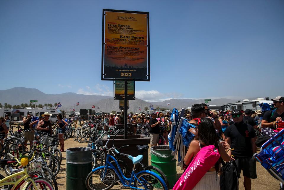 Festivalgoers wait in line for the main gates to open during Stagecoach country music festival in Indio, Calif., Friday, April 26, 2024.