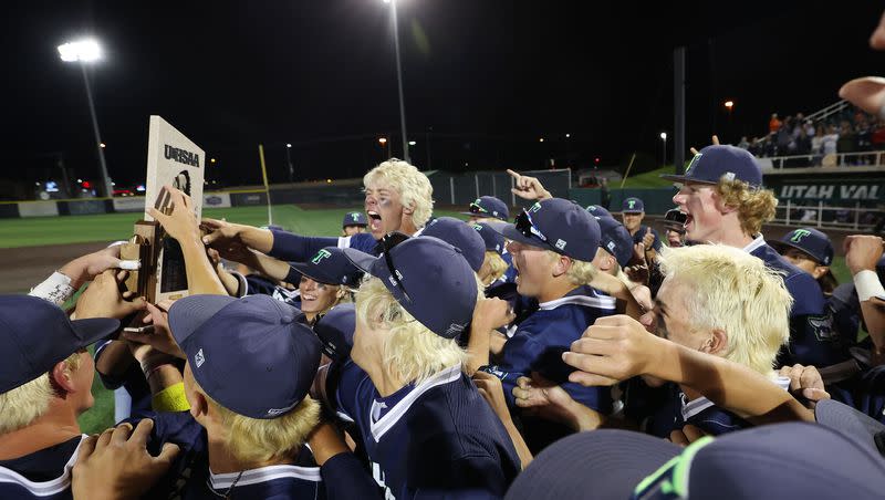 Timpanogos players celebrate their win over Lehi in the 5A state baseball championship in Orem on Saturday, May 27, 2023.