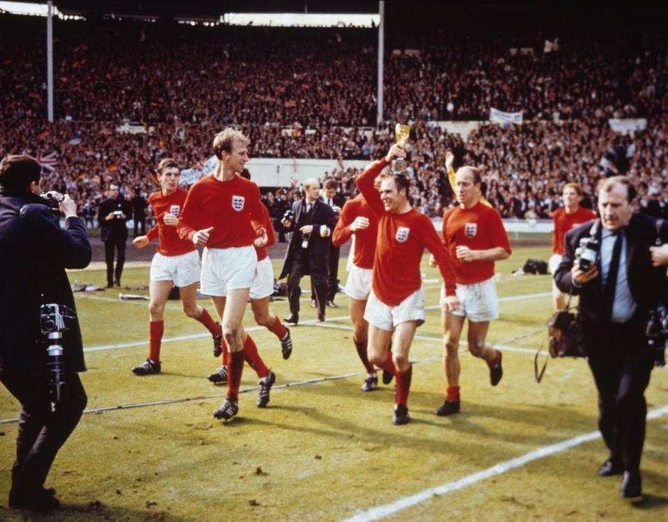Enjoying a lap of honour as world champions in July 1966 (Getty)
