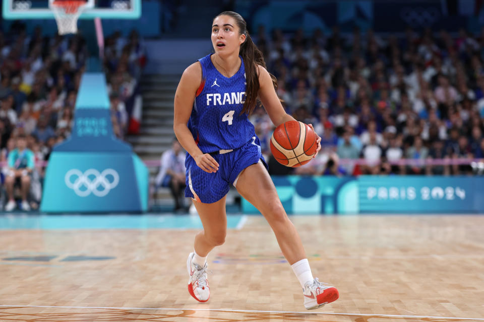 LILLE, FRANCE – AUGUST 04: Marine Fauthoux #4 of the French team dribbles the ball during a Group Stage – Group B match in Women’s Basketball between Australia and France on day ninth of the Paris 2024 Olympic Games at Stade Pierre Mauroy on August 4, 2024 in Lille, France. (Photo by Gregory Shamus/Getty Images)