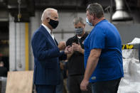 Democratic presidential candidate former Vice President Joe Biden talks with workers as he tours the Wisconsin Aluminum Foundry in Manitowoc, Wis., Monday, Sept. 21, 2020. (AP Photo/Carolyn Kaster)
