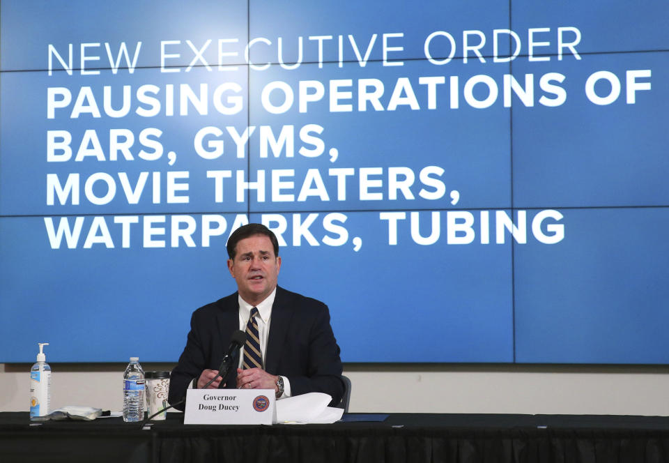 Arizona Gov. Doug Ducey announces a new executive order in response to the rising COVID-19 cases in the state, during a news conference in Phoenix on Monday, June 29, 2020. The governor ordered bars, nightclubs and water parks to close again for at least a month starting Monday night — a dramatic about-face as coronavirus cases surge in the Sunbelt. (Michael Chow/The Arizona Republic via AP, Pool)