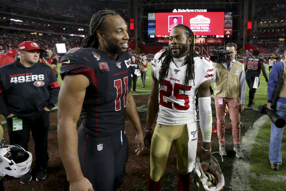 Arizona Cardinals wide receiver Larry Fitzgerald (11) greets San Francisco 49ers cornerback Richard Sherman (25) after an NFL football game, Thursday, Oct. 31, 2019, in Glendale, Ariz. The 49ers won 28-25. (AP Photo/Ross D. Franklin)