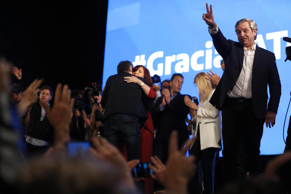 Peronist presidential candidate Alberto Fernández gestures to supporters after incumbent President Mauricio Macri conceded defeat at the end of election day in Buenos Aires, Argentina, Sunday, Oct. 27, 2019. (AP Photo/Natacha Pisarenko)