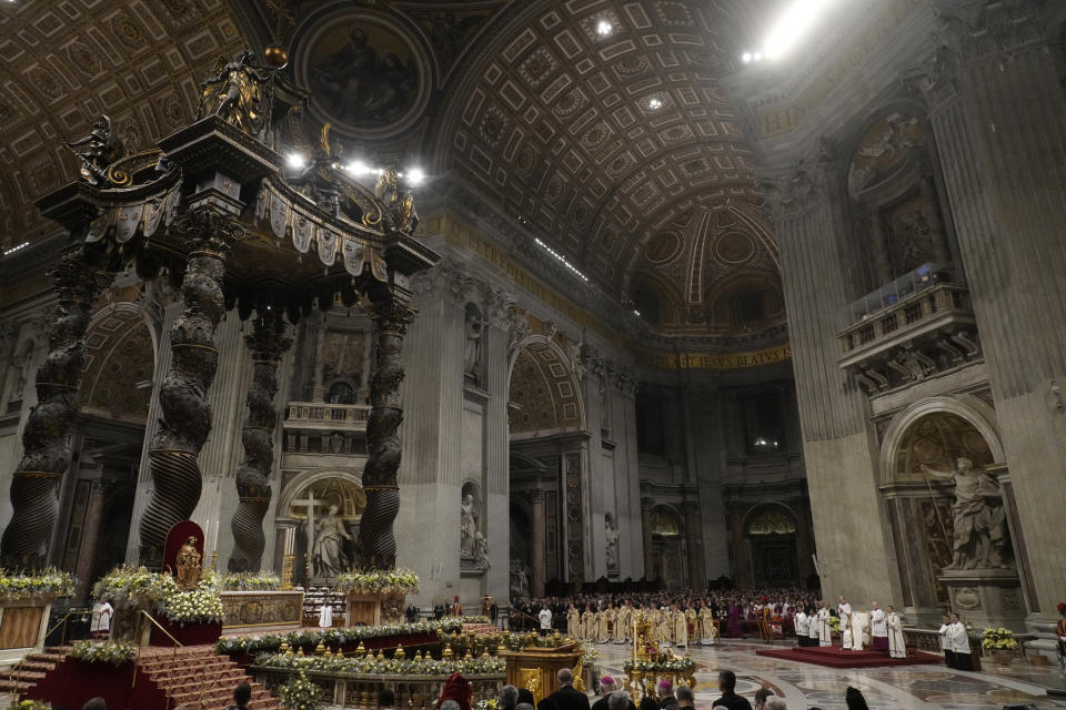 Pope Francis presides over Christmas eve Mass, at St. Peter's Basilica at the Vatican, Sunday Dec. 24, 2023. (AP Photo/Gregorio Borgia)