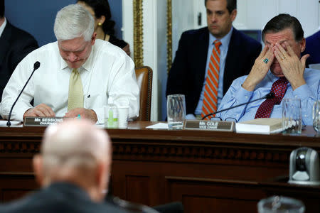 U.S. House Rules Committee Chairman Representative Pete Sessions (R-TX) (L) and Representative Tom Cole (R-OK) (R) preside over an early-morning committee hearing on health care legislation to repeal Obamacare at the U.S. Capitol in Washington, U.S., March 24, 2017. REUTERS/Jonathan Ernst