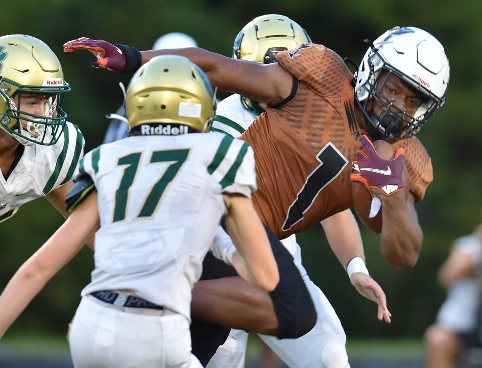 Atlantic Coast running back Arthur Walker runs against the Nease defense in a September game. Both teams earned at-large berths in Class 7A.