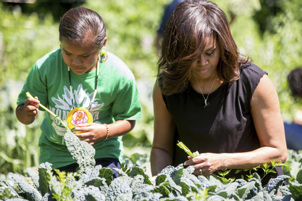 First lady Michelle Obama, joined by school children from across the country, harvest the White House Kitchen Garden at the White House in Washington. (Photo: AP Photo/Andrew Harnik, File)