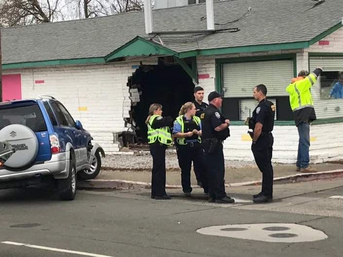 Police officers stand in front of the Great Adventures Christian Preschool in Anderson. A vehicle crashed into the day care around 2:30 p.m. on Thursday, March 3, 2022, sending at least 14 children to the hospital.