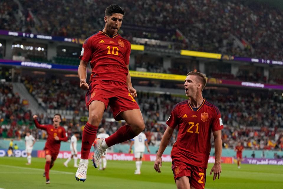 Spain's Marco Asensio, left, celebrates with Dani Olmo after scoring his side's second goal during the World Cup group E football match between Spain and Costa Rica, at the Al Thumama Stadium in Doha, Qatar, Wednesday, Nov. 23, 2022. (AP Photo/Alessandra Tarantino)