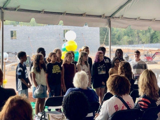 Students perform a song at the groundbreaking ceremony for W.P. Grier Middle School.