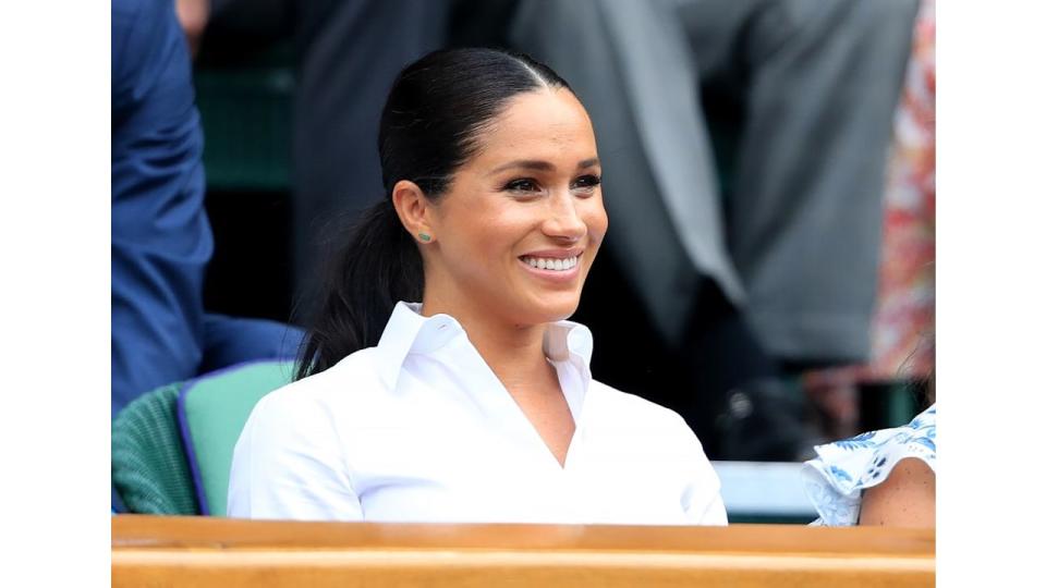 Meghan markle smiling in crisp white shirt