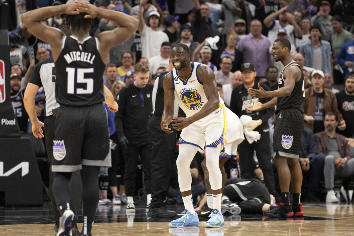 Golden State Warriors forward Draymond Green (23) reacts towards the referee after a play with Sacramento Kings forward Domantas Sabonis (10) laying on the court during the fourth quarter in game two of the first round of the 2023 NBA playoffs at Golden 1 Center. Mandatory Credit: Kyle Terada-USA TODAY Sports
