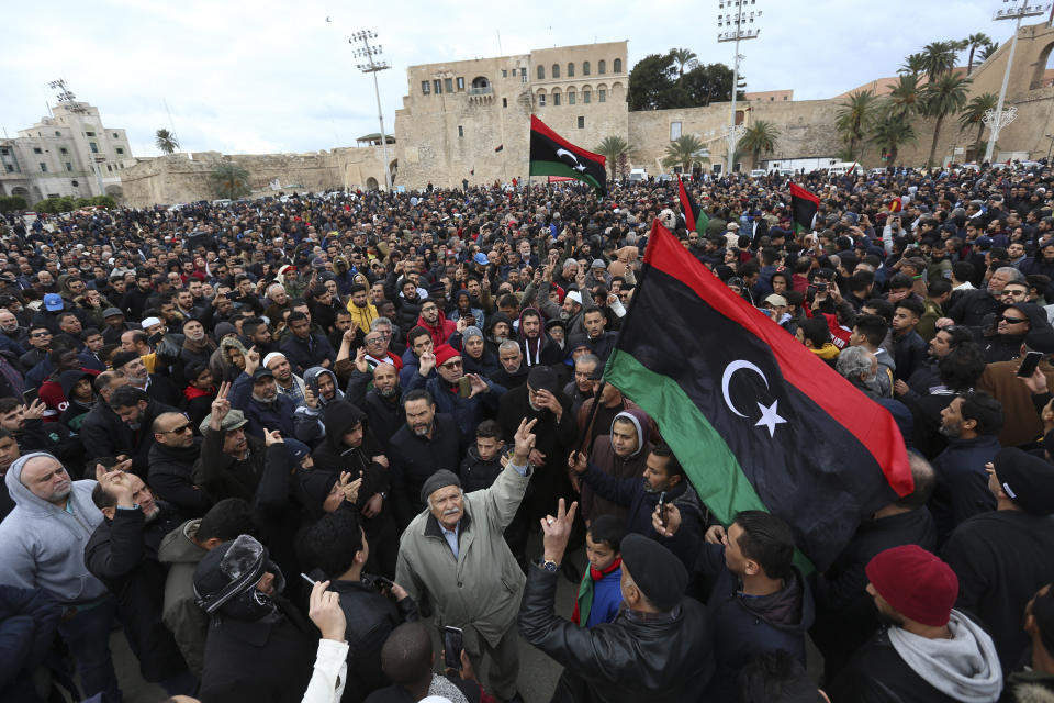 People attend a funeral of military cadets in Tripoli, Libya, Sunday, Jan. 5, 2020. Health officials said the death toll from the airstrike climbed to at least 30 people, most of them students and over 30 others were wounded. The airstrike took place in the city's south late Saturday, an area which has seen heavy clashes in recent months. Forces based in eastern Libya and led by Gen. Khalifa Hifter have been fighting to seize the capital from the weak but U.N.-supported government. (AP Photo/Hazem Ahmed)