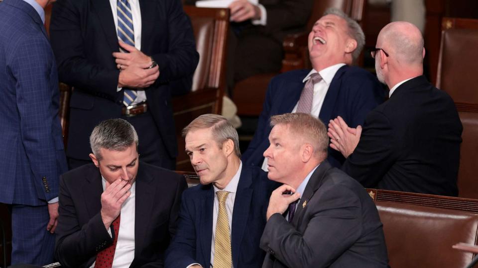 PHOTO: Rep. Jim Jordan talks to a staff member and Rep. Warren Davidson while former Speaker of the House Kevin McCarthy laughs, as the House of Representatives prepares to vote on a new Speaker of the House at the Capitol Building, Oct. 17, 2023. (Win Mcnamee/Getty Images)