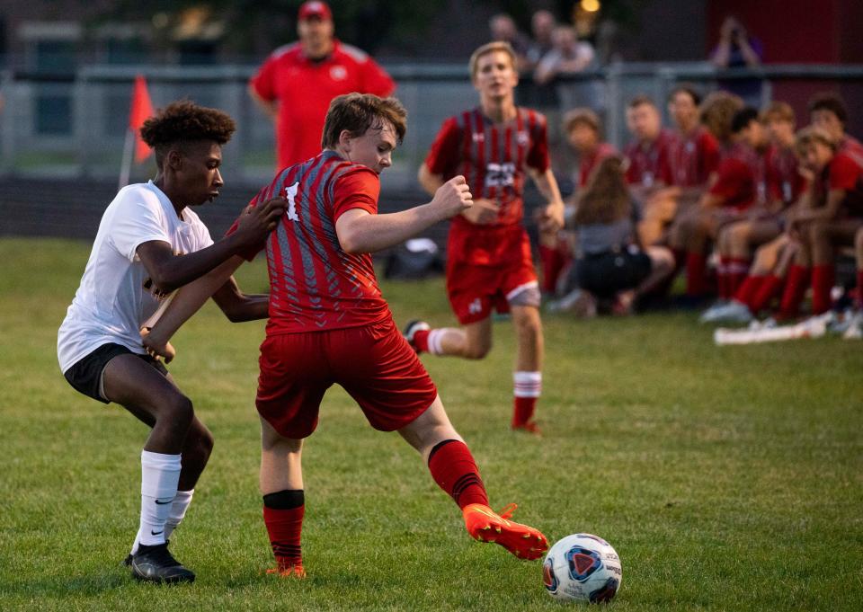 Westfall's Landon Powers (1) kicks the ball behind around a Miami Trace player in varsity boys soccer action at Westfall High School on Aug. 25, 2022 in Williamsport, Ohio.