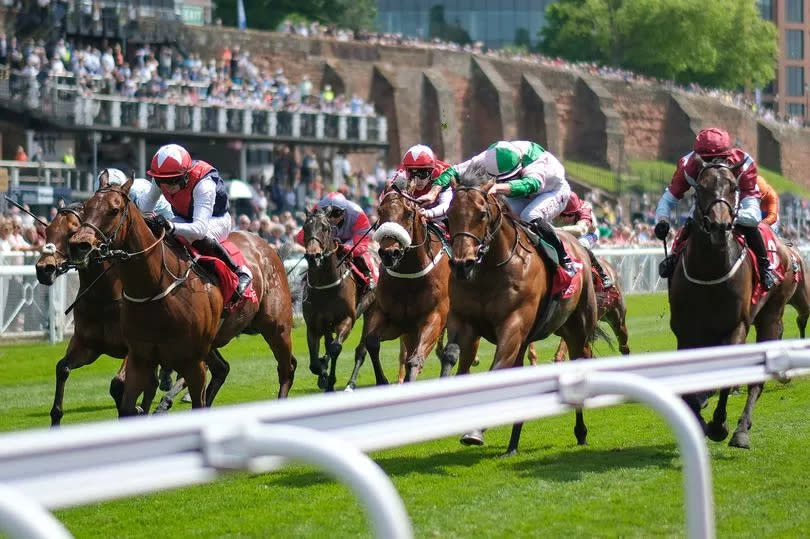 Tom Marquand and Democracy Dilemma (right, pink/green) win the CAA Stellar Handicap on day two of the Boodles Chester May Festival at Chester Racecourse on Thursday, May 9 2024