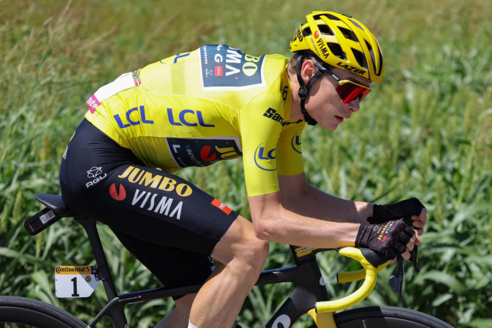 Jumbo-Visma's Danish rider Jonas Vingegaard wearing the overall leader's yellow jersey cycles during the 13th stage of the 110th edition of the Tour de France cycling race, 138 km between Chatillon-sur-Chalaronne in central-eastern France and Grand Colombier, in the Jura mountains, in France, on July 14, 2023. (Photo by Thomas SAMSON / AFP)