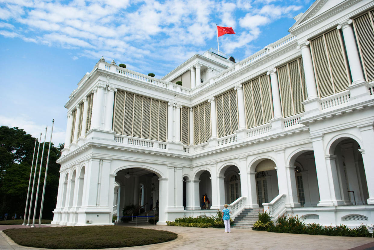 Singapore flag waving on the roof of The Istana of Singapore.