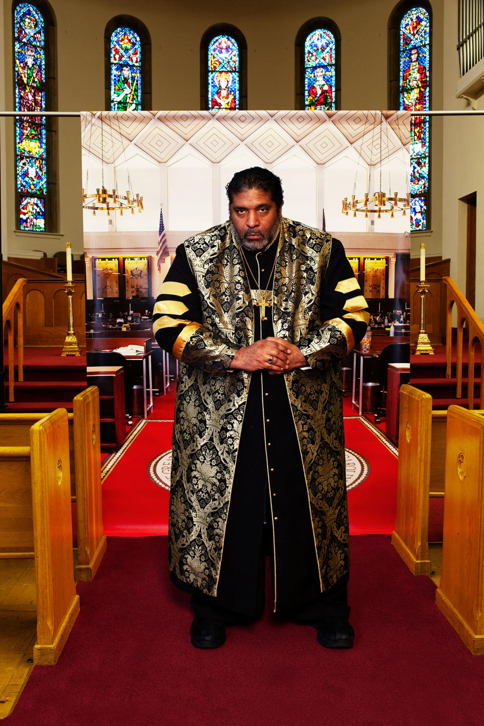 <strong>The Rev. William J. Barber II</strong> at Pullen Memorial Baptist Church in Raleigh, N.C., on Jan. 27, before a backdrop showing the North Carolina house of representatives chamber where he was arrested in 2011. "<a href="https://time.com/5784068/william-barber-ii-faith-injustice/" rel="nofollow noopener" target="_blank" data-ylk="slk:The Equalizers;elm:context_link;itc:0;sec:content-canvas" class="link ">The Equalizers</a>," March 2 issue.<span class="copyright">Endia Beal for TIME</span>