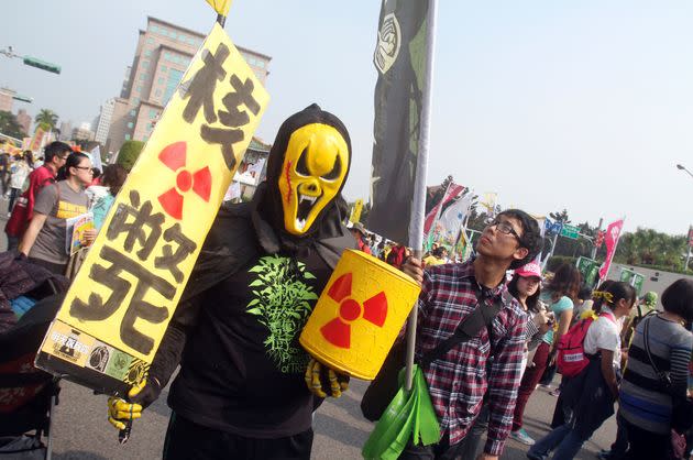 A protester holds a slogan reading 