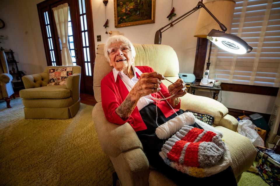 Lenore "Gundy" Costello, who turns 107 on Sunday, started knitting at age 12 and now regularly knits caps for chemotherapy patients, often while watching Tampa Bay Rays baseball games on TV.